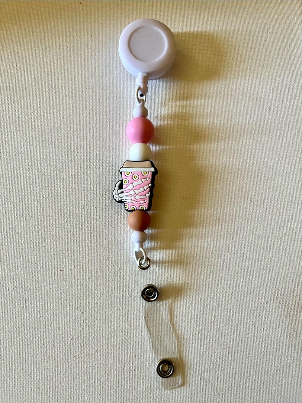 Beaded Badge Reel with Skeleton Holding a Coffee Cup Charm